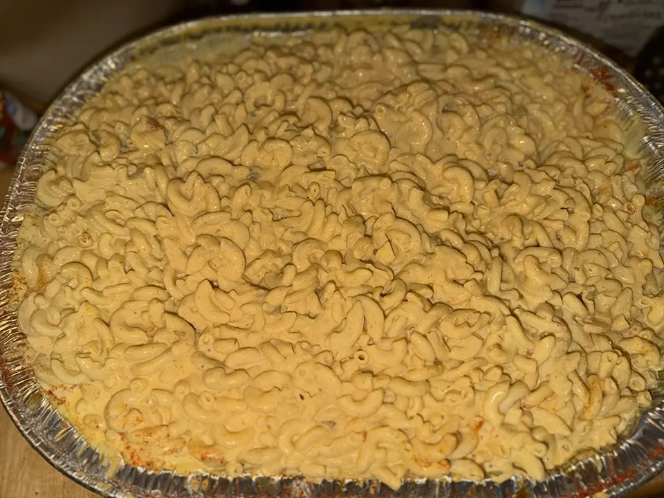 A large pan of macaroni and cheese ready to serve